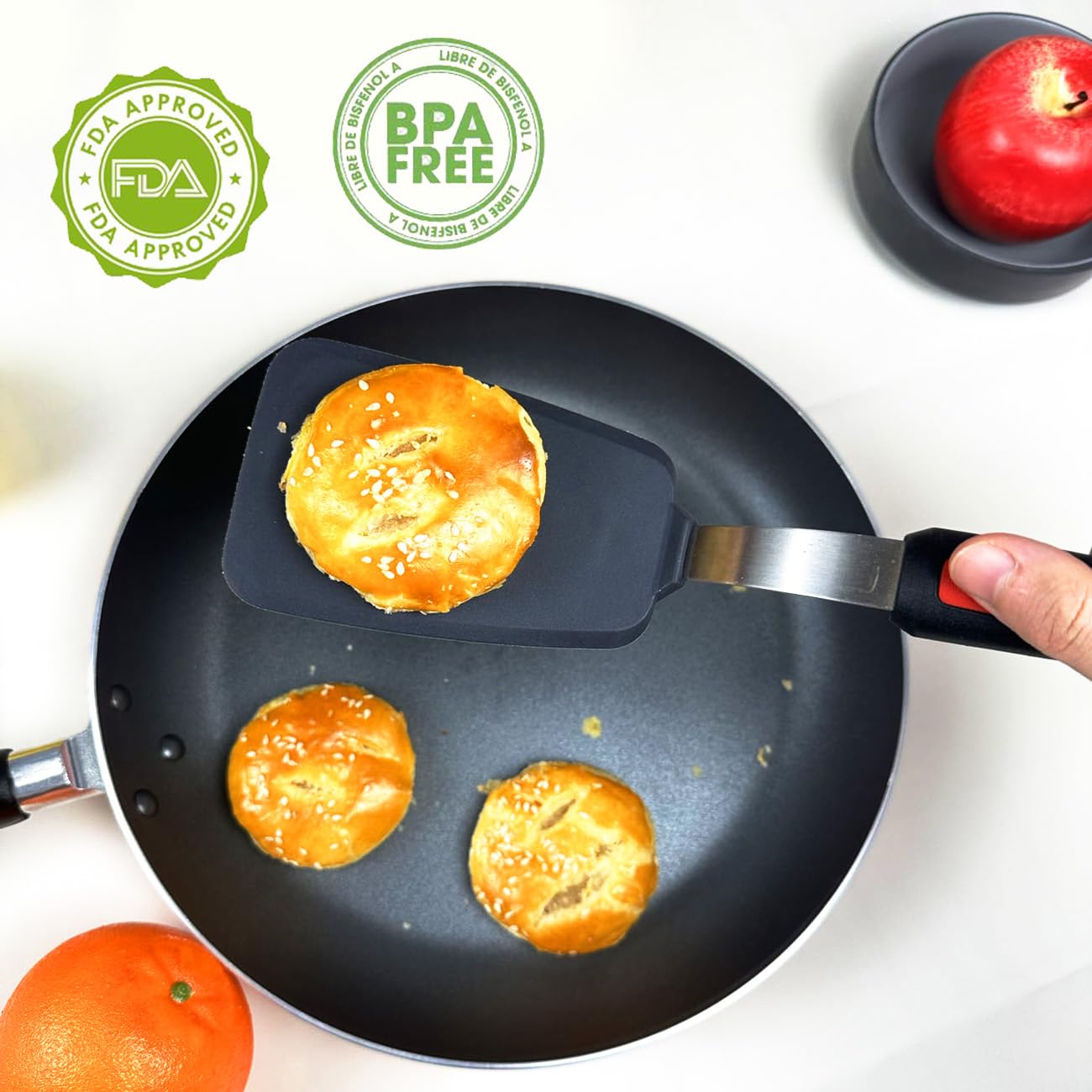 KLAQQED ergonomic-handle spatula for comfortable grip during long cooking sessions.