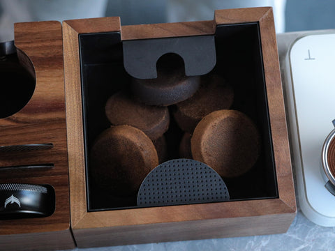 KNODOS wooden espresso knock box on counter ready for efficient grounds disposal.