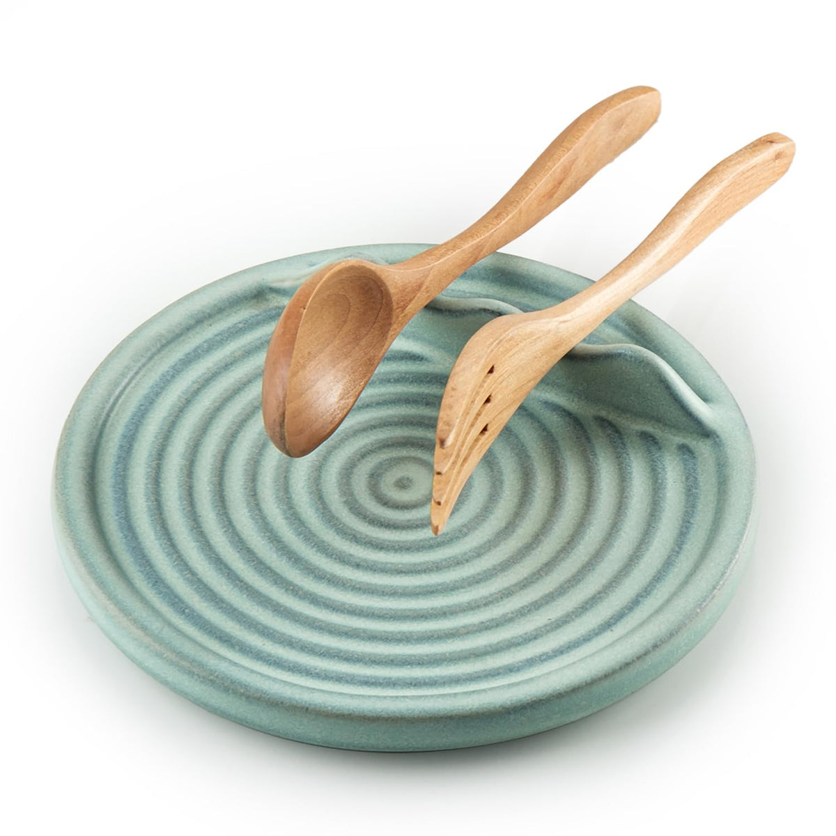 KOKUNKA spoon rest on stove top with blue ceramic glaze to keep counters tidy.