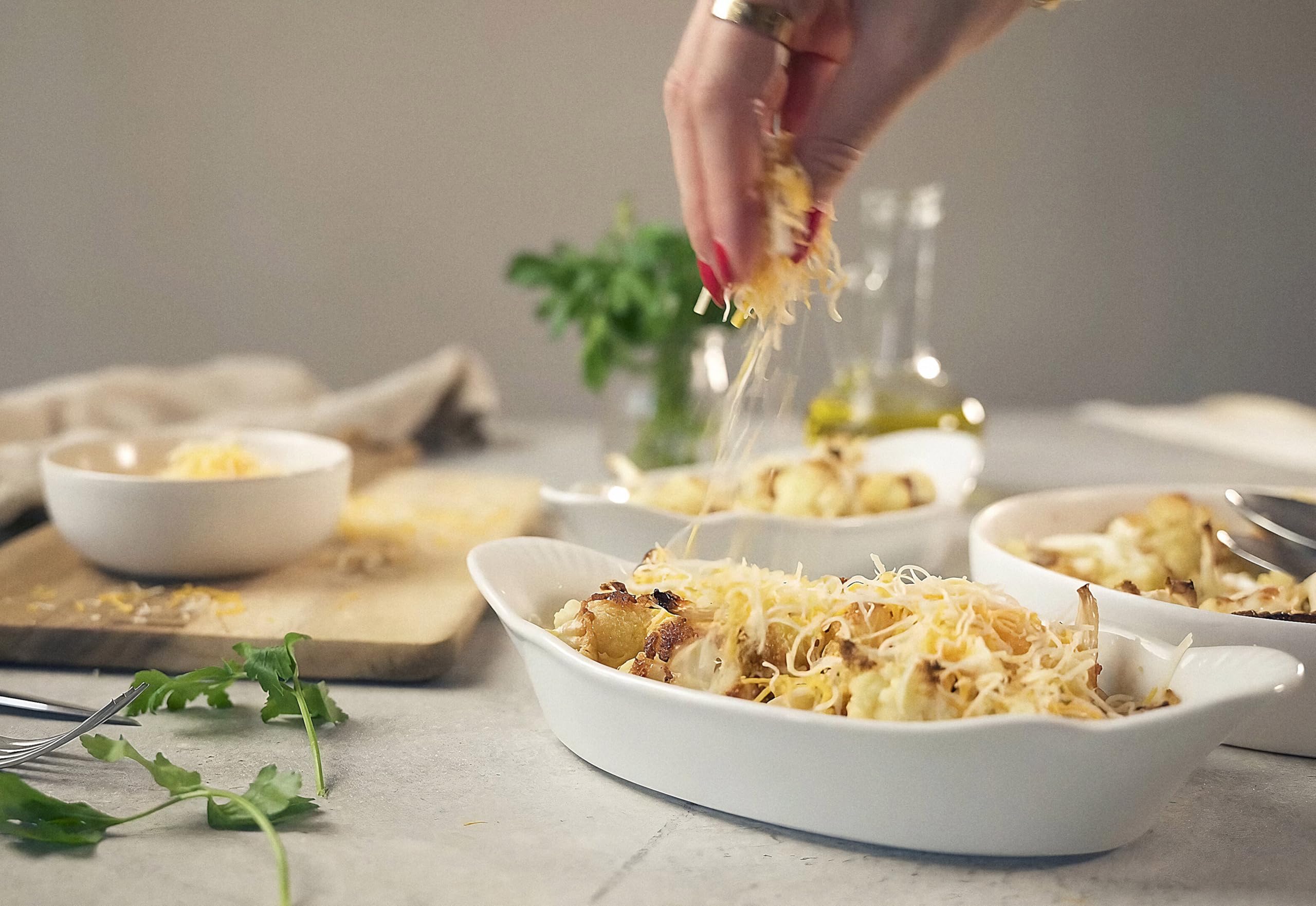 KooK dishes with scalloped handles for secure transfer from oven to table.