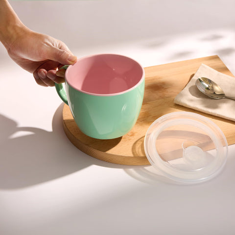 KooK two-toned ceramic mug showcases mint and coral glaze for daily meals.