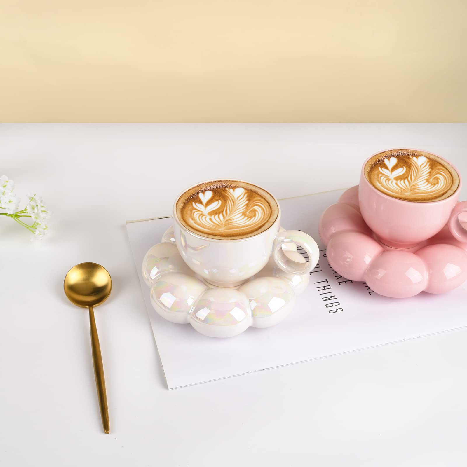 Koythin coffee mug with saucer set on a kitchen counter.