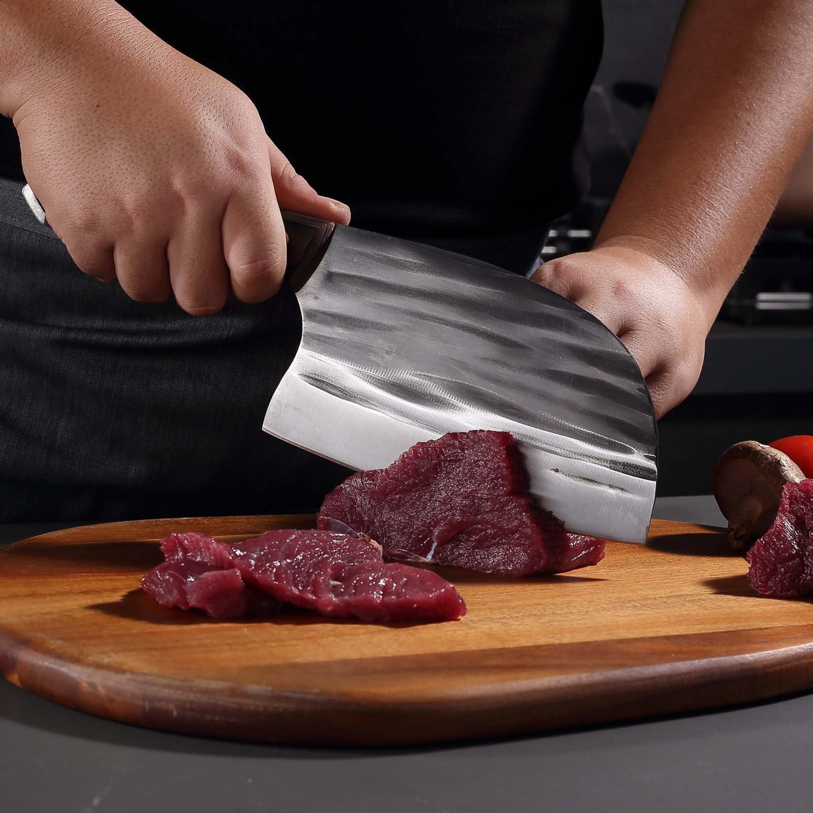 Krononidler bone-cleaver in hand demonstrates power for poultry and pork