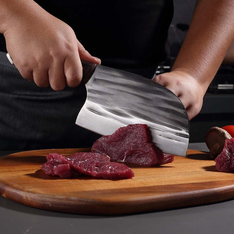 Krononidler bone-cleaver in hand demonstrates power for poultry and pork