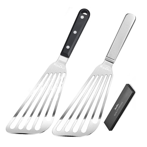 KSENDALO fish spatula with slotted blade gliding under a fillet for delicate flipping.