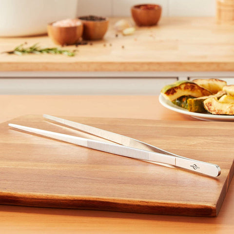 Küchenprofi 12-Inch Tweezer Tongs ideal for turning and plating vegetables.
