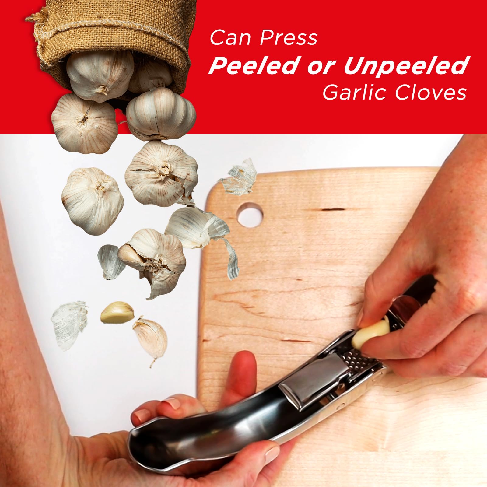 Kuhn Rikon Epicurean Garlic Press in use over a dish ready to add minced garlic