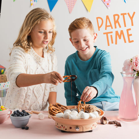 Kusini fondue with dippers like fruit and marshmallows creates fun dessert moments.