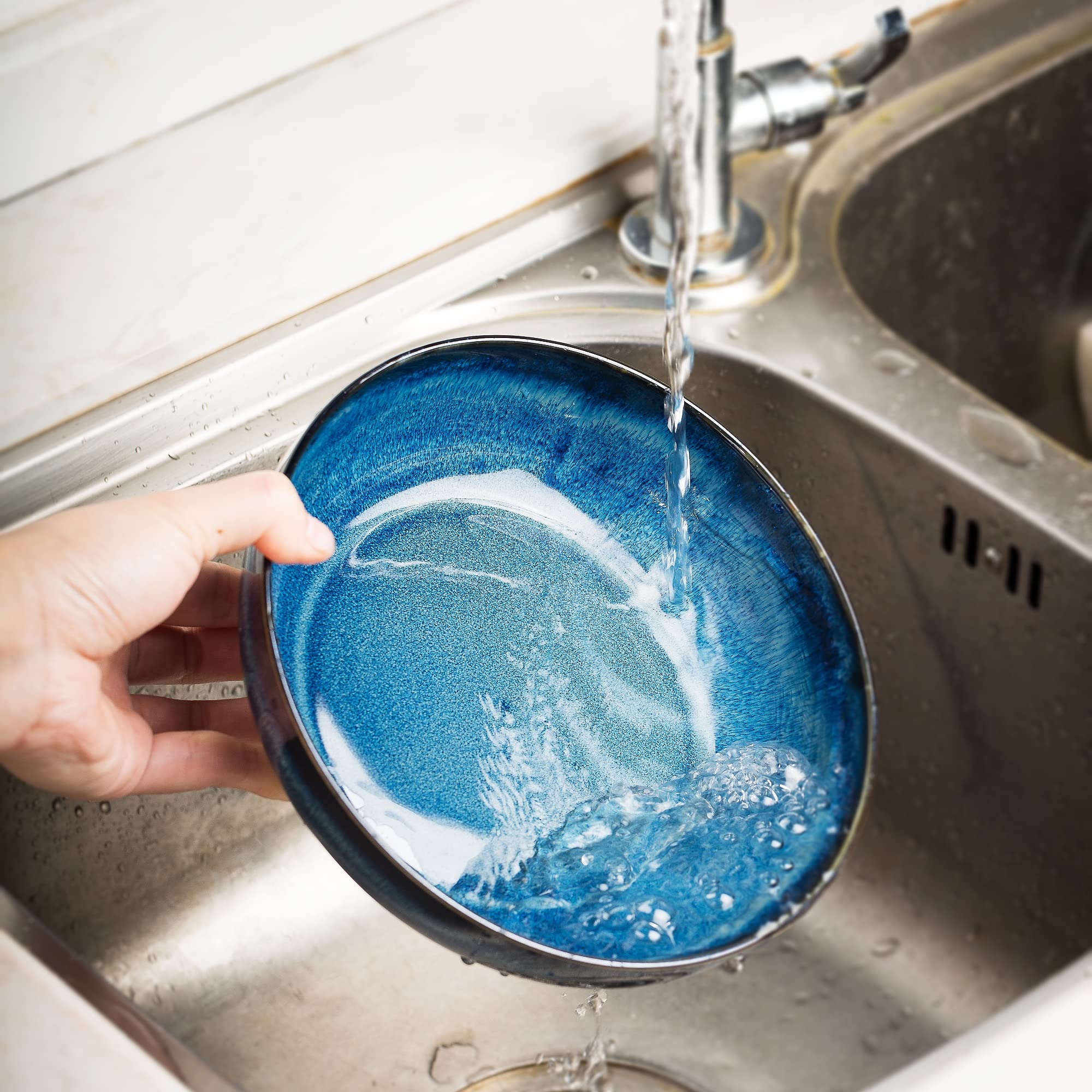 KYBSCZ stackable porcelain bowls saving cupboard space.