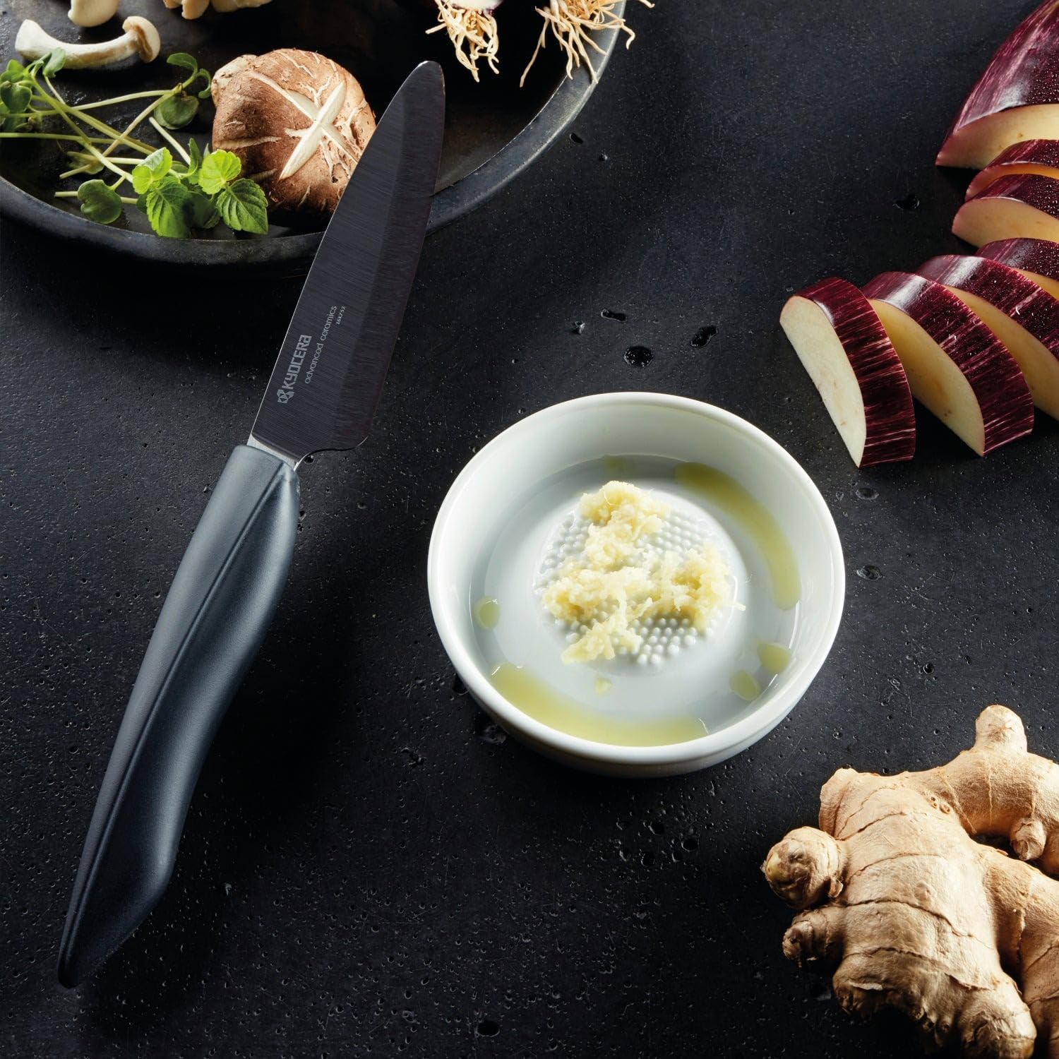 KYOCERA ceramic grater delivers fine cheese shavings with clean, non-reactive results.