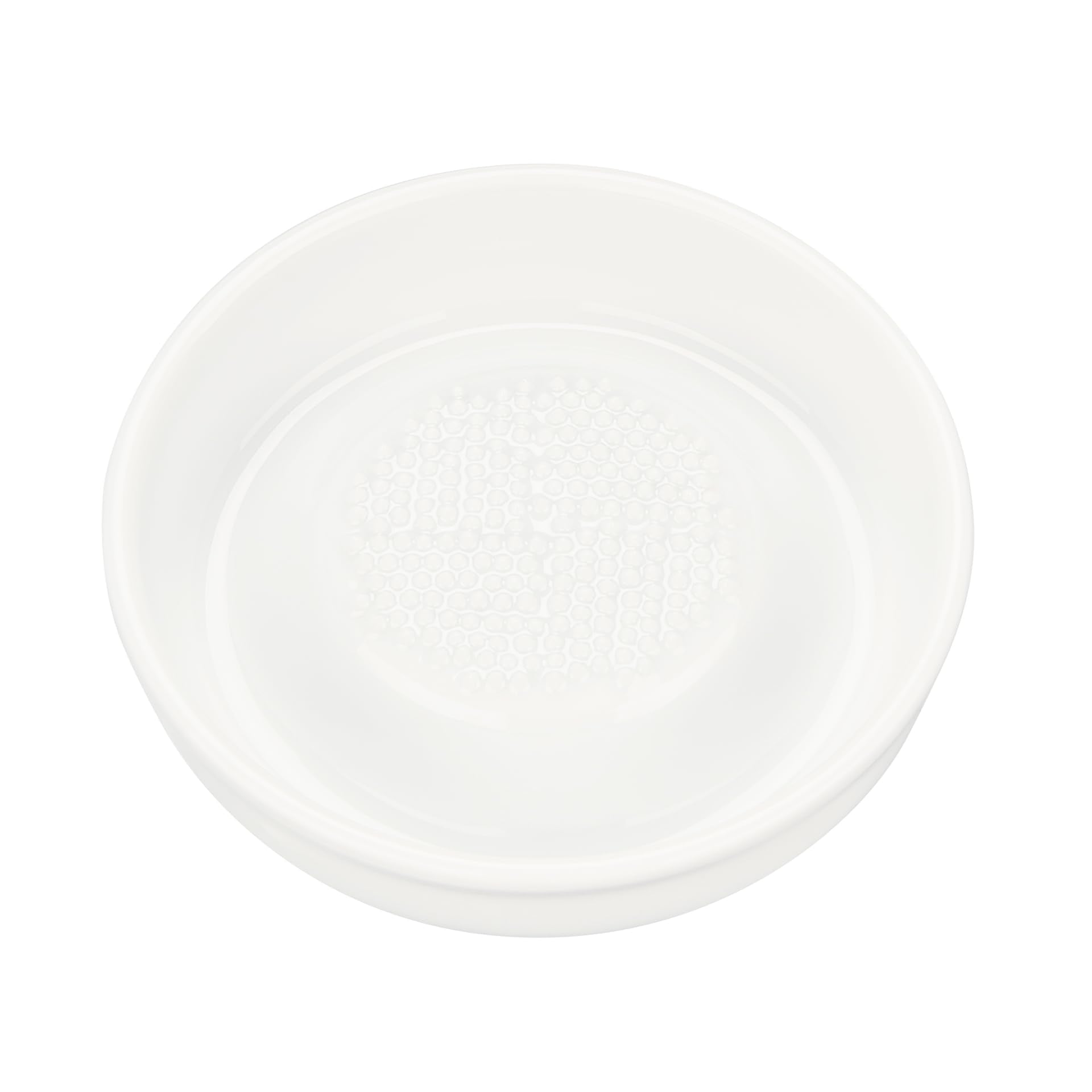 KYOCERA 3.5-inch ceramic grater shredding ginger for fresh flavor and aroma.