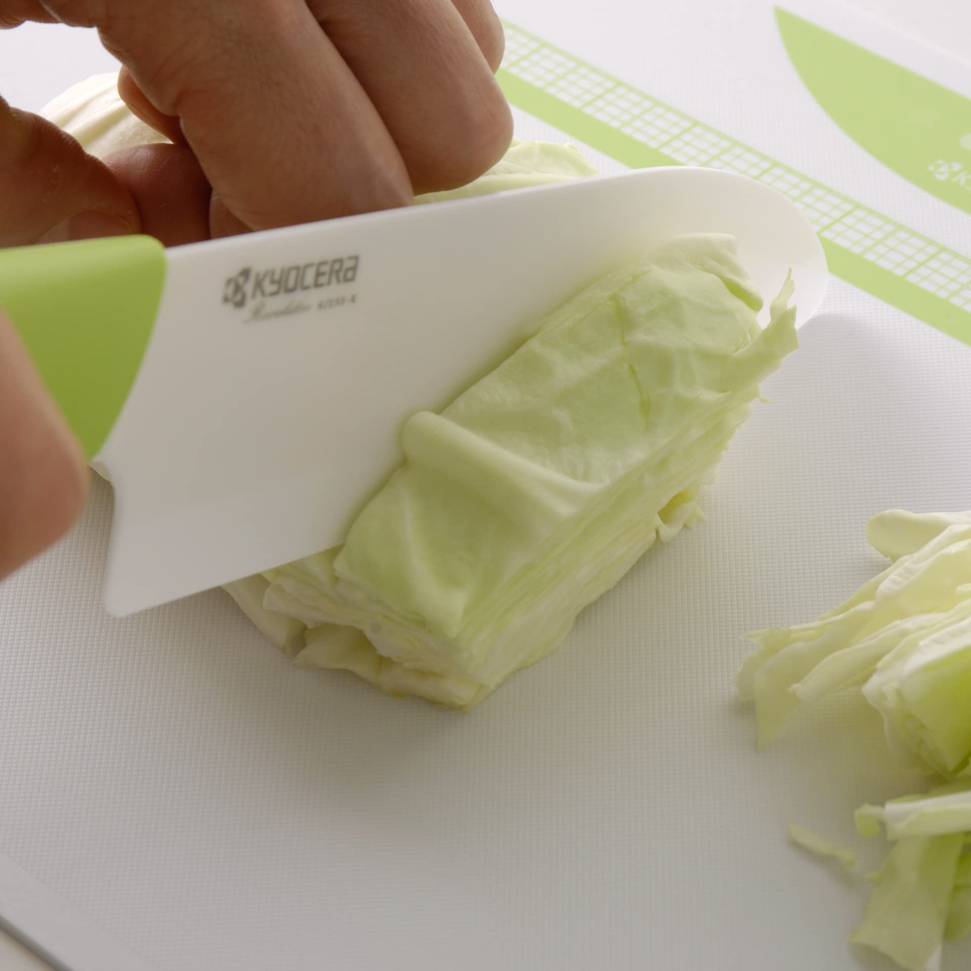 KYOCERA Revolution 4.5-inch utility knife for versatile prep with a green handle