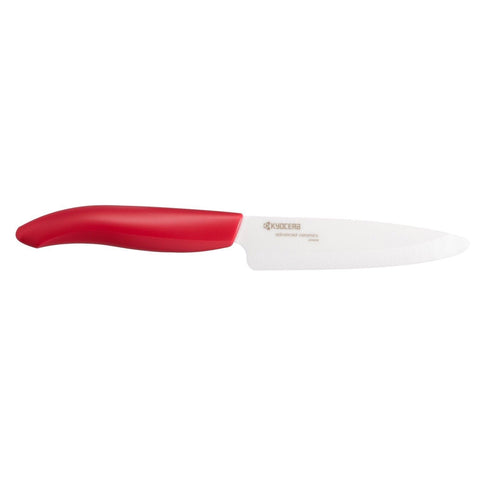 Kyocera Revolution ceramic knife blade close-up highlights precise fruit and vegetable slicing.