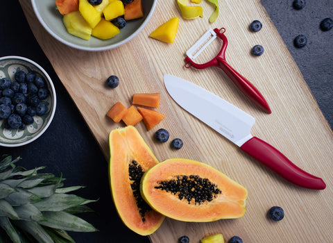 Kyocera Revolution ceramic knife in hand demonstrates ergonomic control for precise prep.