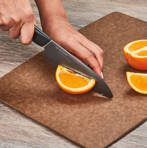 Kyocera Revolution Santoku knife with ergonomic handle for precise control.