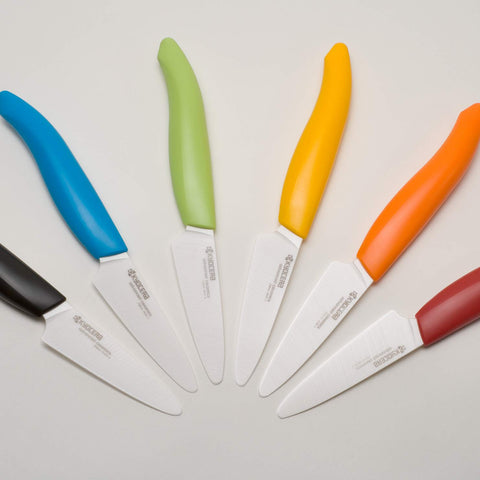 Kyocera Revolution Series 3 inch paring knife slicing fruit for prep tasks.