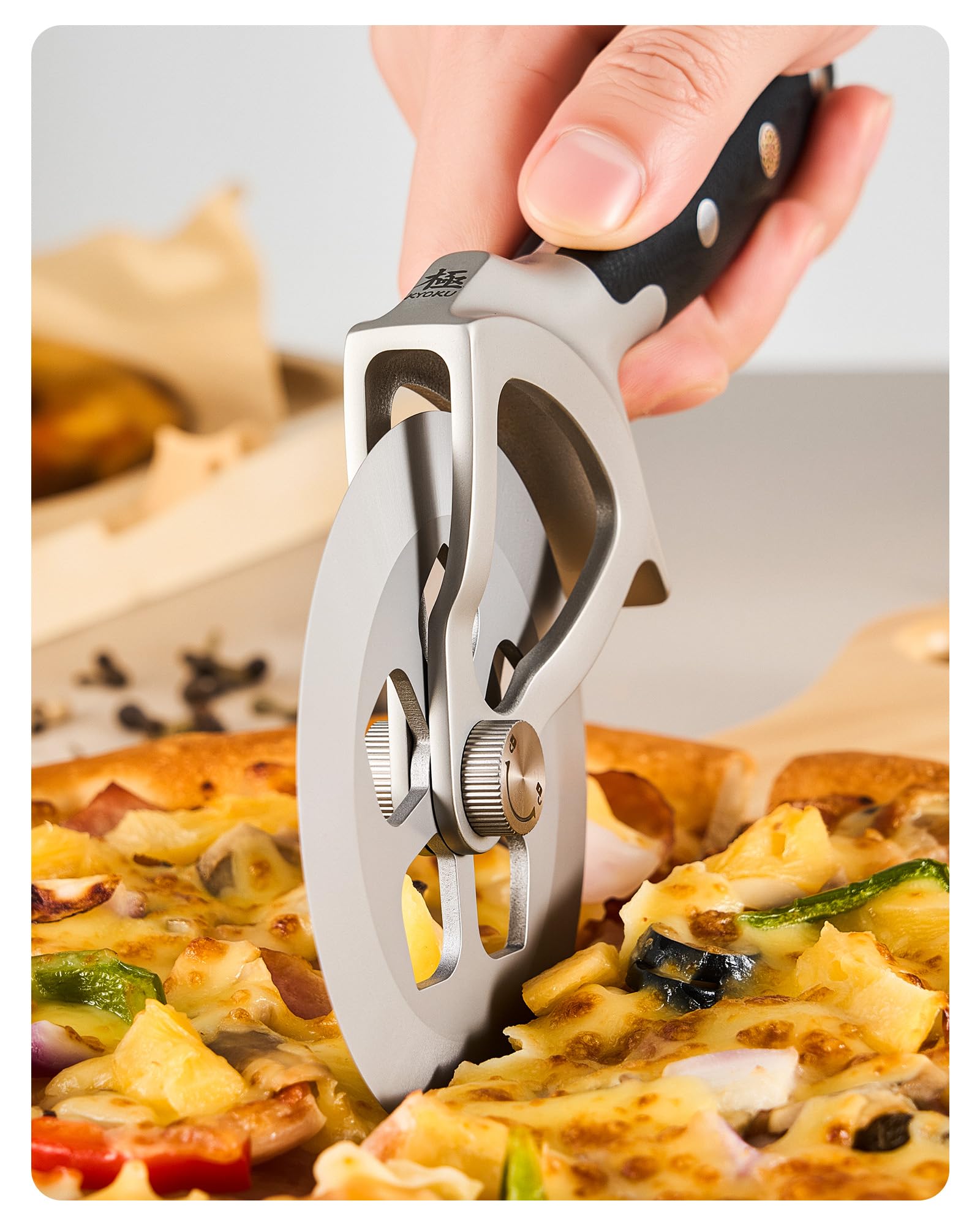 KYOKU pizza slicer wheel in high-carbon steel for clean, even cuts.