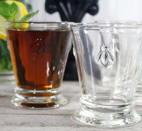 La Rochere Napoleon Bee tumbler filled with juice for casual gatherings.