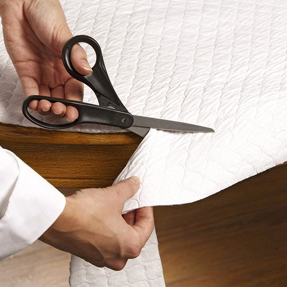 LAMINET deluxe cushioned table pad protects the dining surface from spills and scratches.