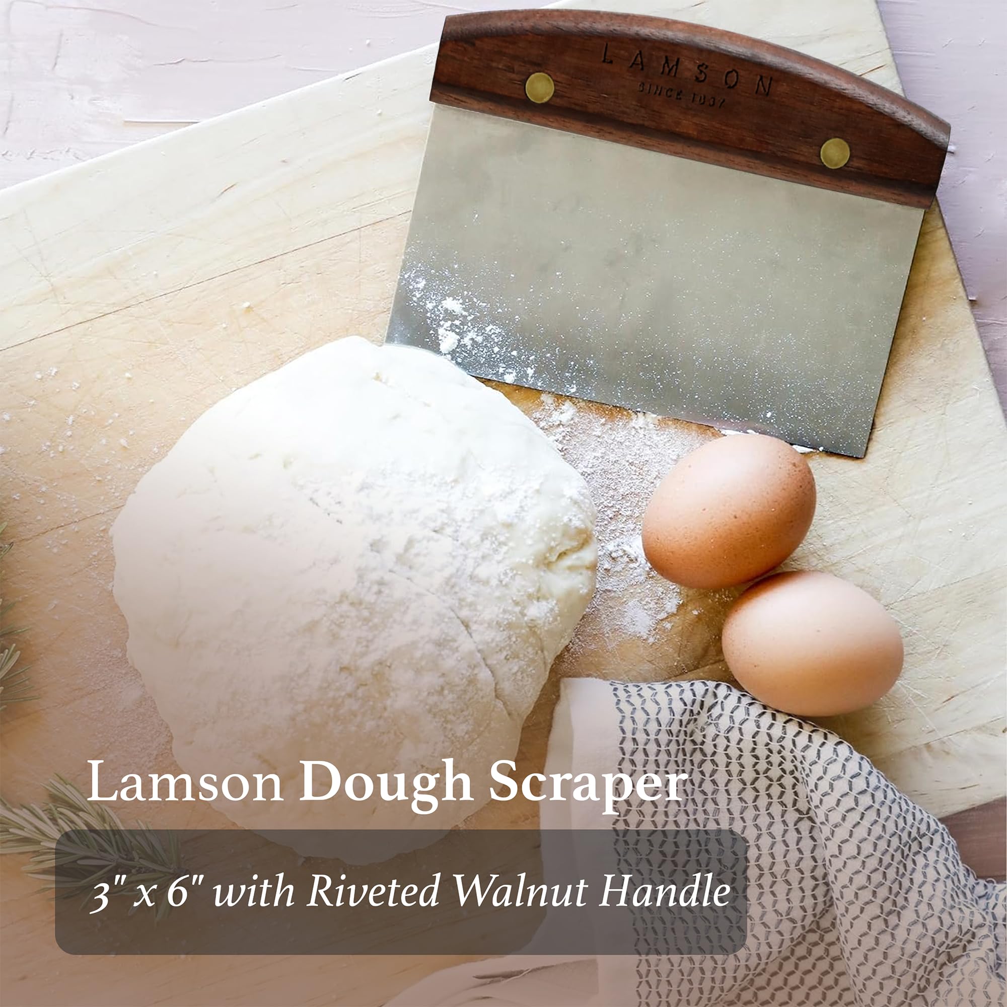 Lamson bench scraper on flour-dusted board for quick cleanup.