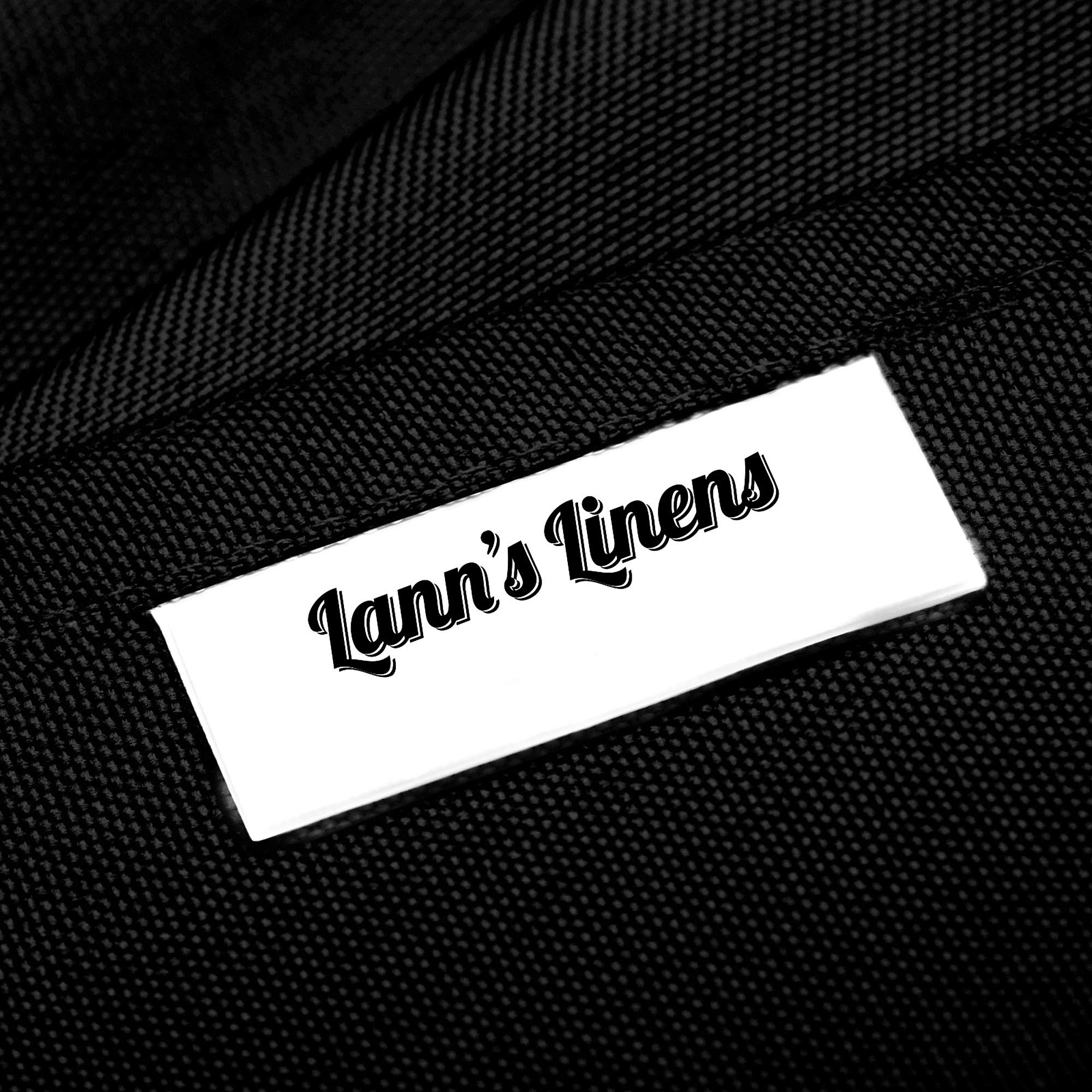 Lann's Linens fitted edge close-up demonstrates secure hem and wrinkle resistance.