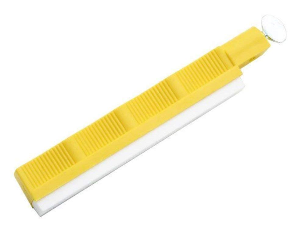 Lansky yellow holder with hone demonstrates stable grip for controlled sharpening.