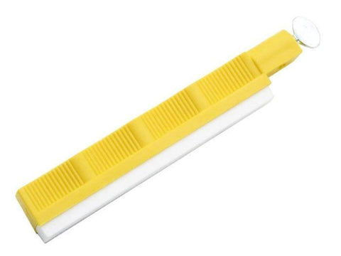 Lansky yellow holder with hone demonstrates stable grip for controlled sharpening.
