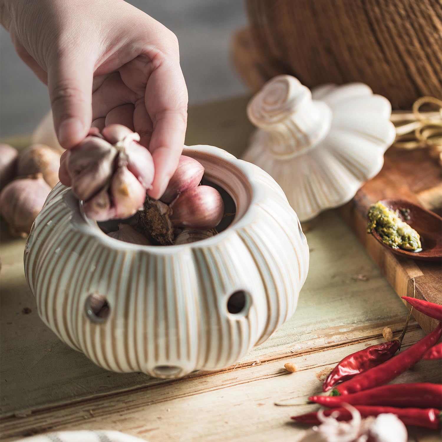 Large capacity holds multiple garlic bulbs and even accommodates onions or ginger.