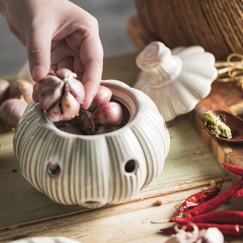 Large capacity holds multiple garlic bulbs and even accommodates onions or ginger.