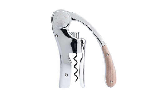 L'Atelier du Vin Oeno Motion lever corkscrew in action for smooth uncorking at tastings.