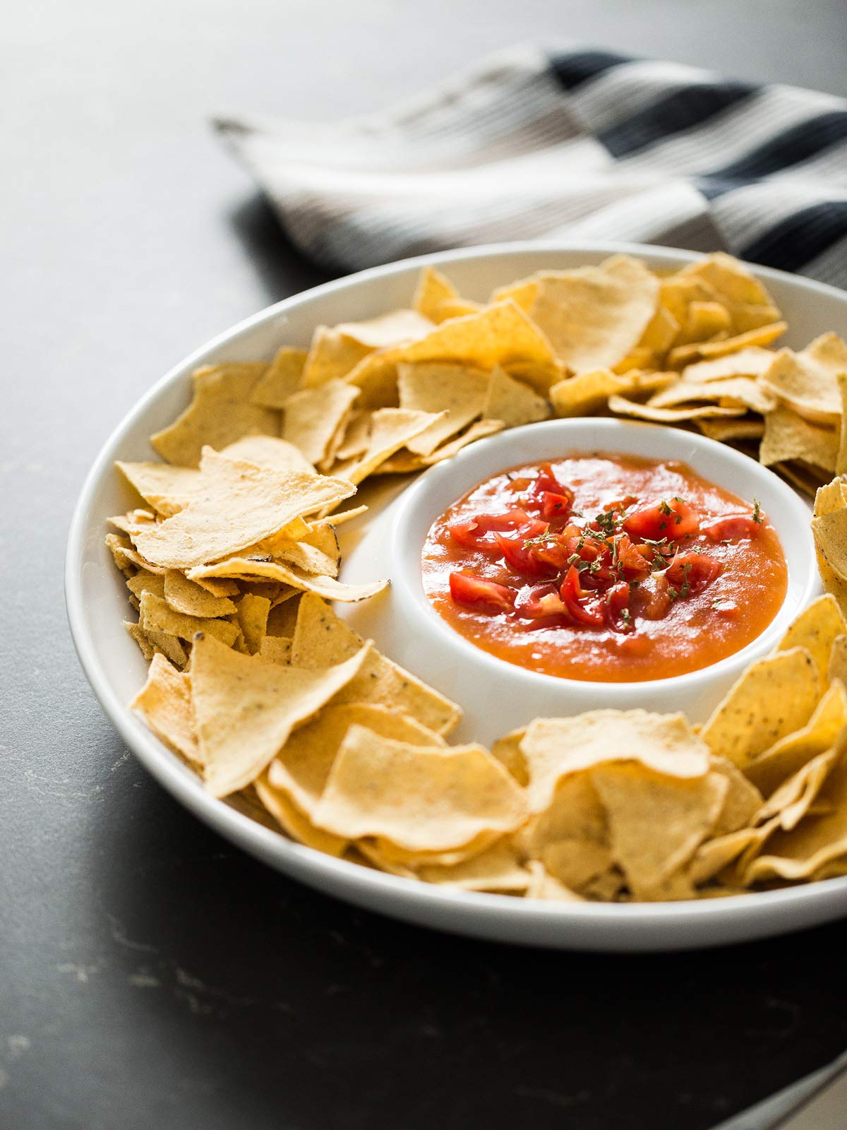 Lauchuh divided serving tray displayed in bright dining room for gatherings.