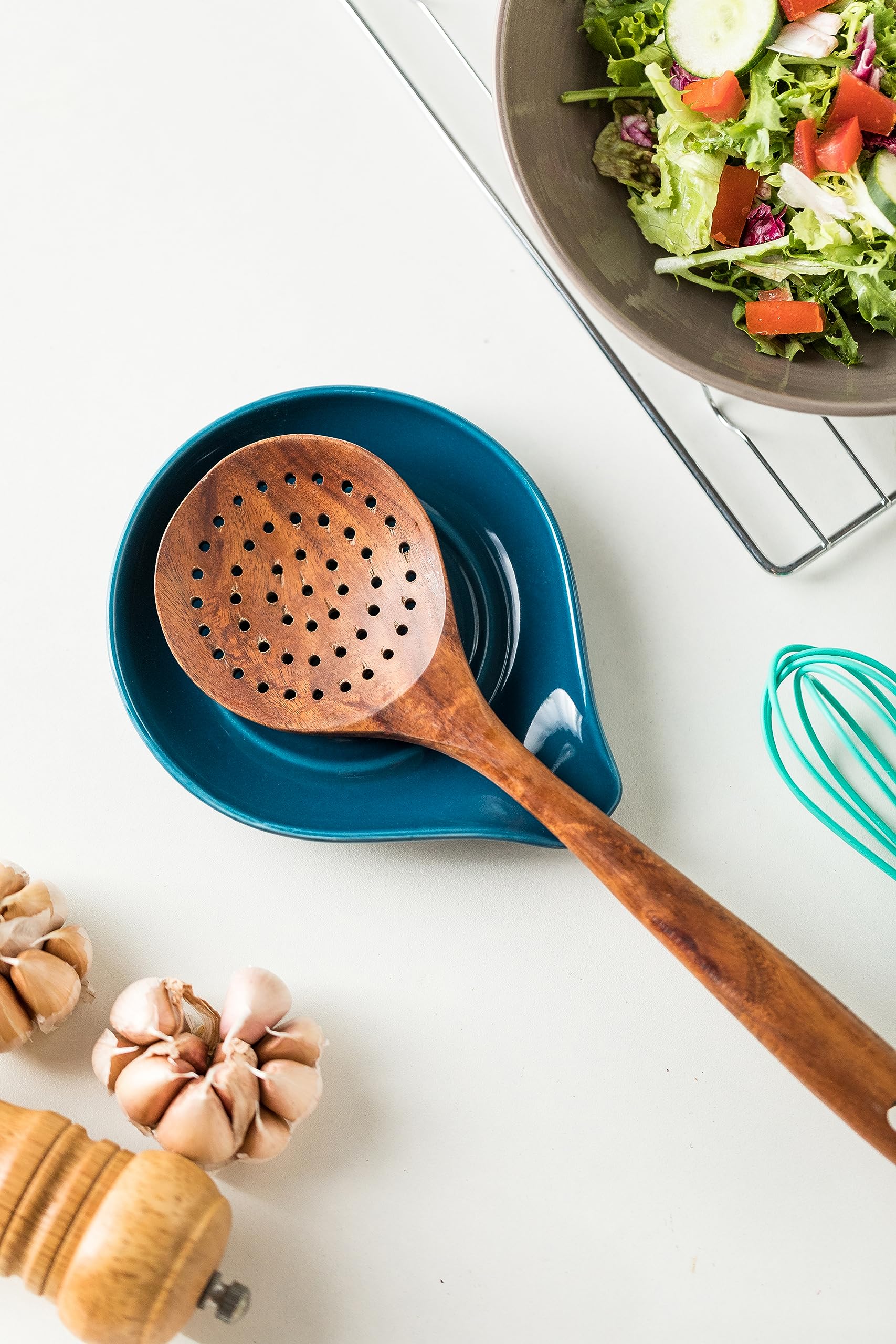 LAUCHUH spoon rest with centered depression holds varied utensils securely.