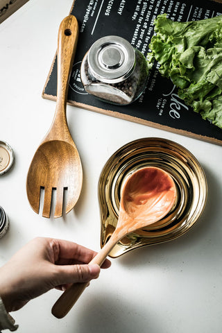LAUCHUH spoon rest in gold accent adds elegance while protecting countertops.