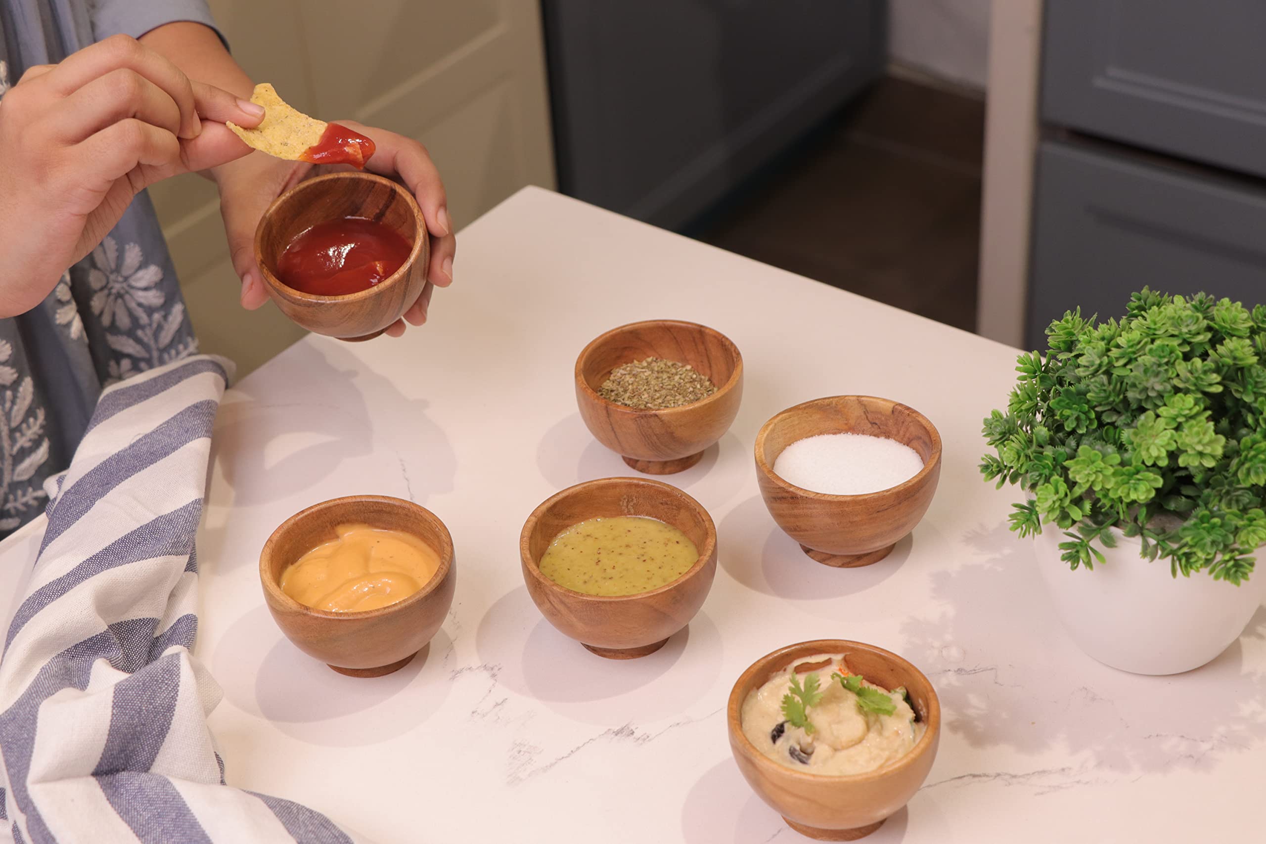 Lavaux Designs acacia bowls used for dips and condiments on a serving board