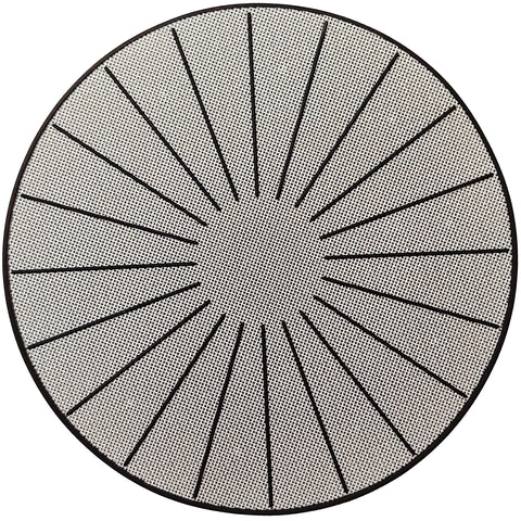 Lazy K induction mat on stovetop providing surface protection and non-slip stability during cooking.