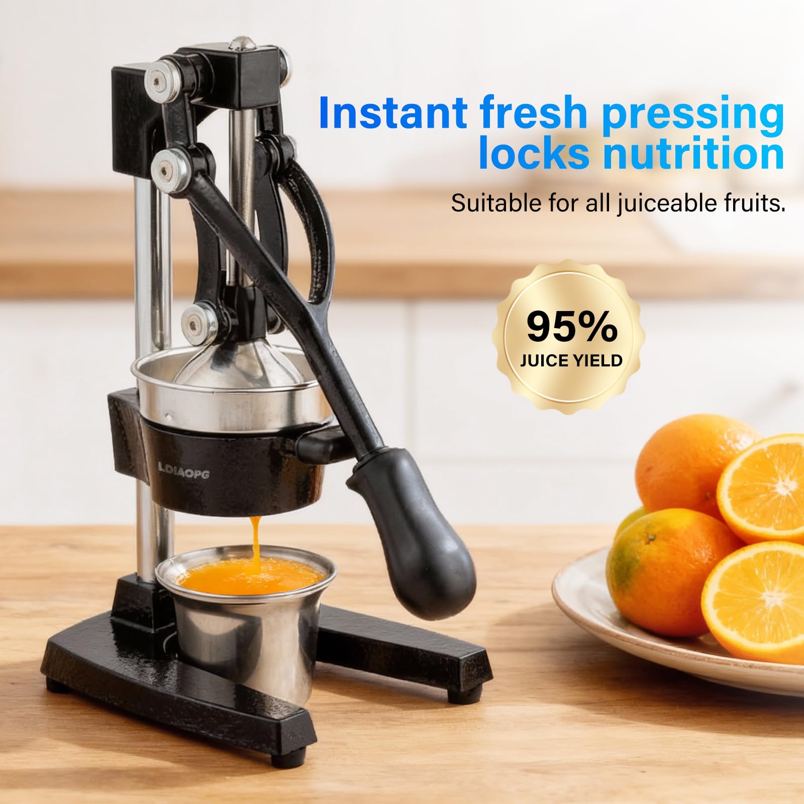 Ldiaopg orange lemon squeezer in use over a glass for fresh juice.