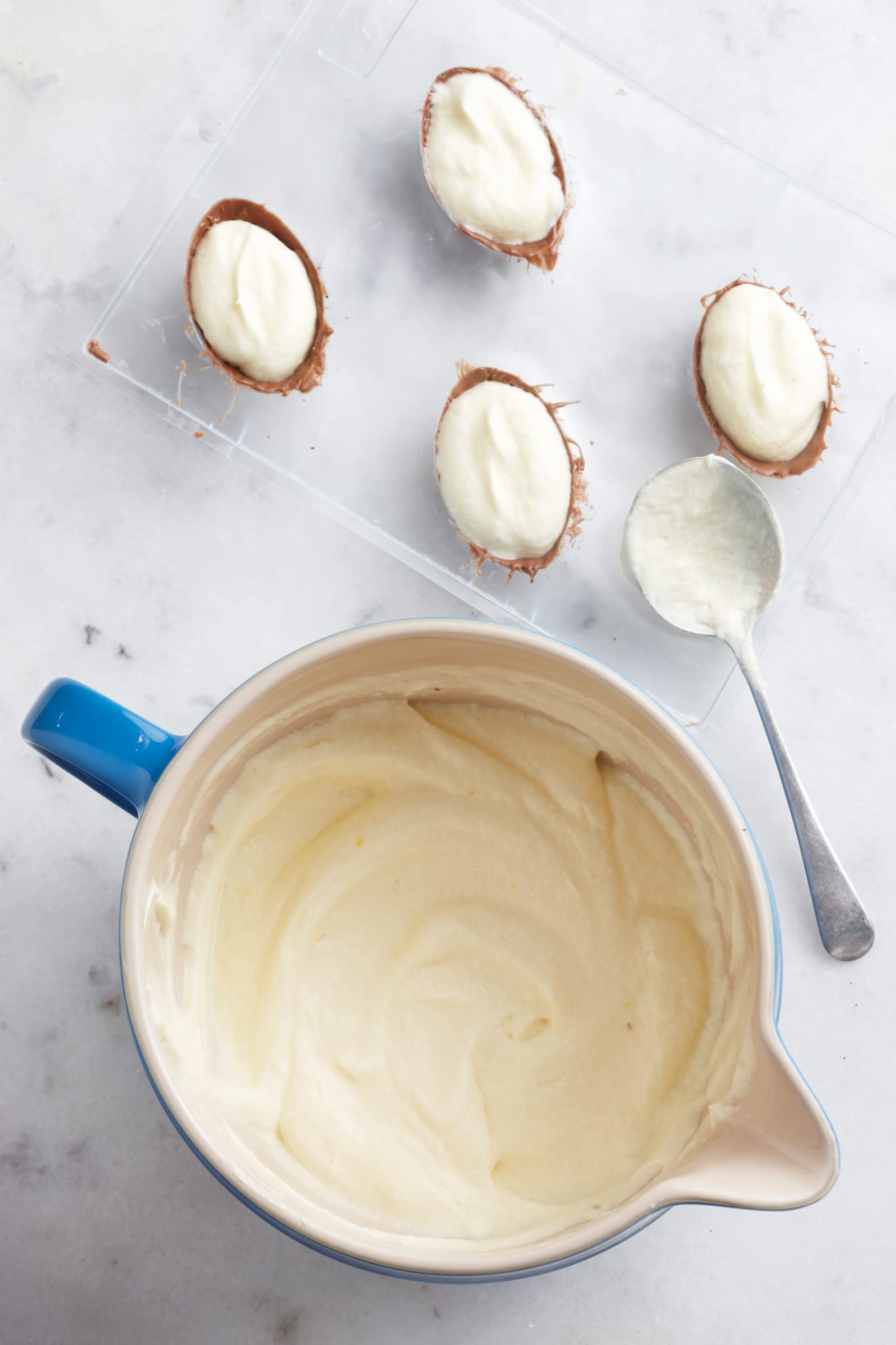 Le Creuset Marseille batter bowl on countertop, dishwasher-safe for quick cleanup.