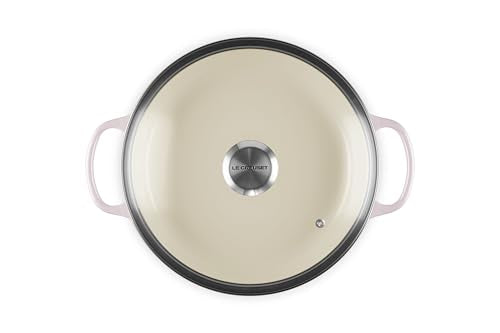 Le Creuset round braiser interior view shows light enamel for easy cooking progress checks.