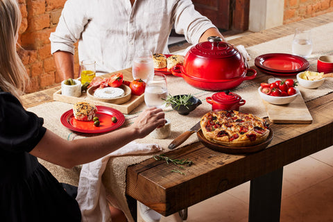 Le Creuset Bread Oven Cerise enamel surface cleans easily.