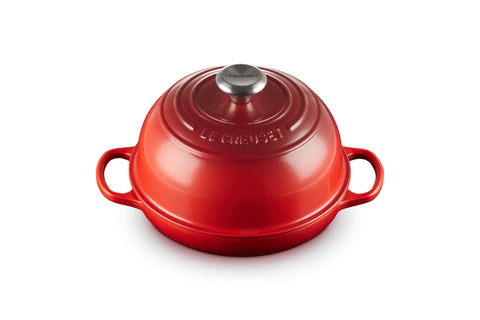 Le Creuset Bread Oven Cerise full view shows vibrant color and iconic silhouette.