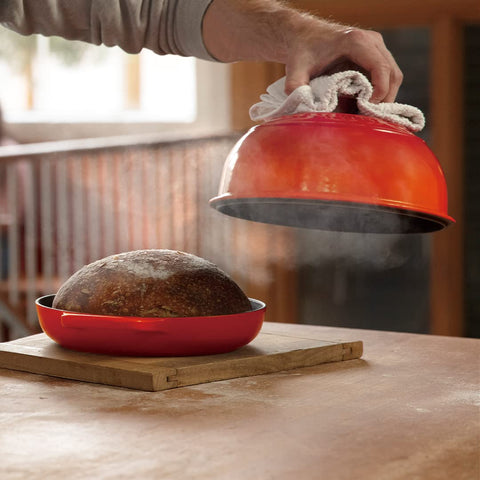 Le Creuset Bread Oven Flame enamel finish resists sticking and wear