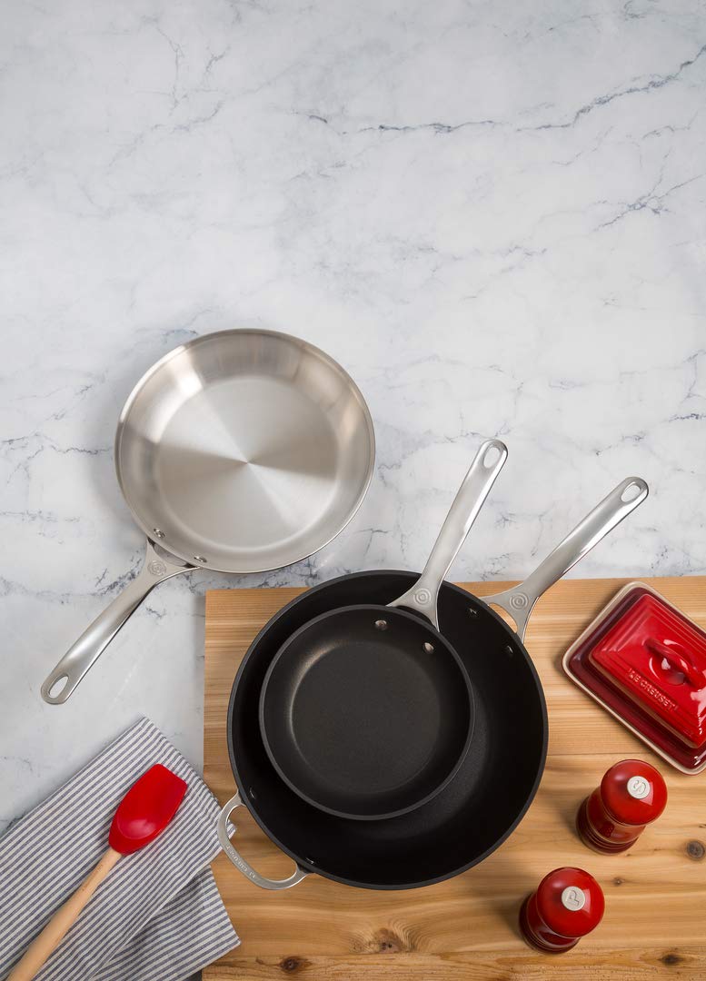 Le Creuset butter dish Cerise interior glaze close-up for near-nonstick release and easy cleanup.