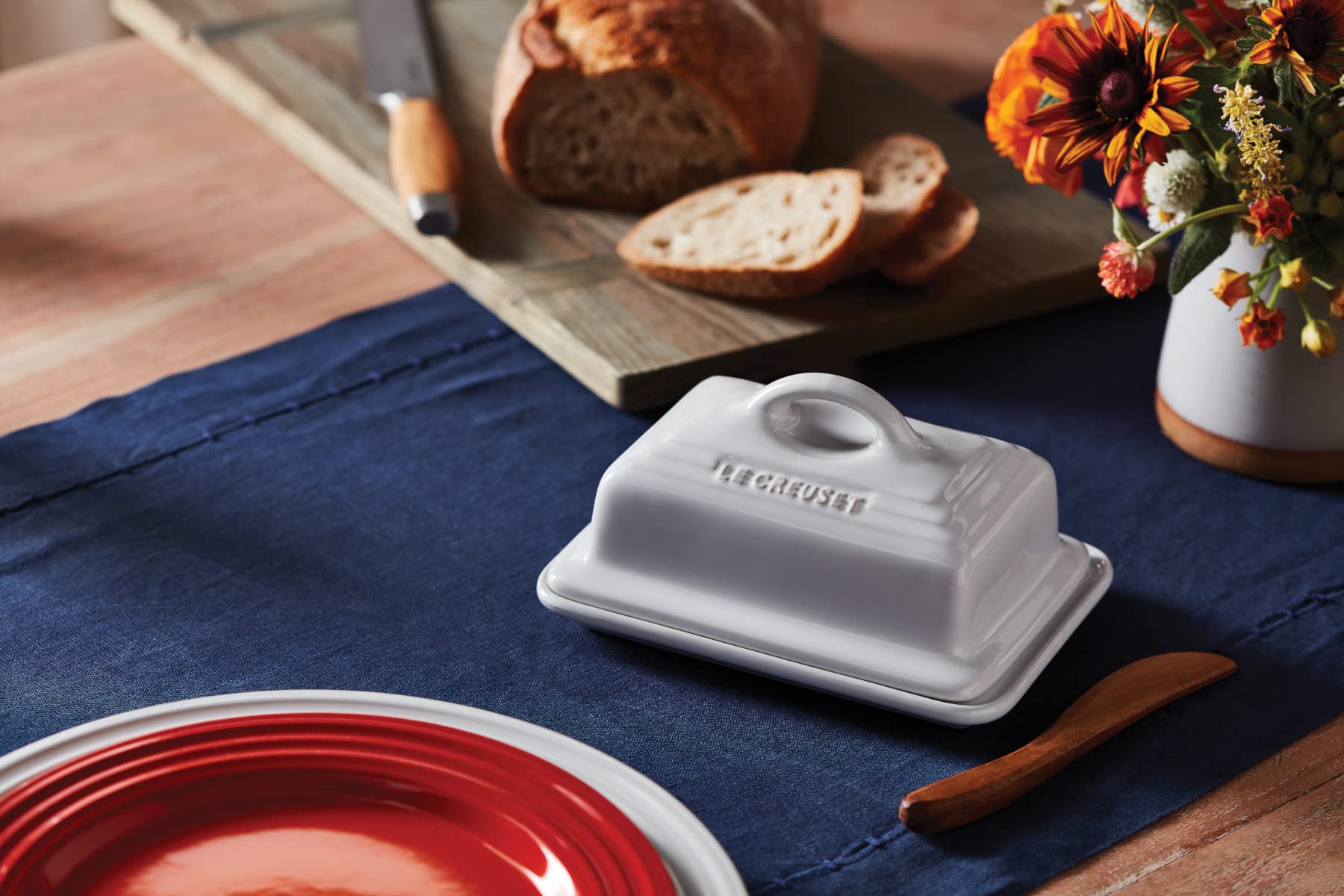 Le Creuset butter dish white lid closed illustrates secure fridge storage.