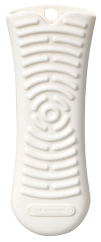 Le Creuset cool tool handle on a cookware handle, heat-resistant protection for safer transfers.