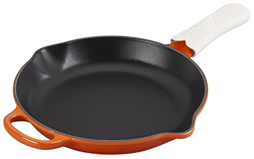 Le Creuset silicone cool tool handle attached to a pan handle, dishwasher-safe and easy to store.
