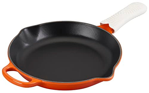 Le Creuset silicone cool tool handle attached to a pan handle, dishwasher-safe and easy to store.
