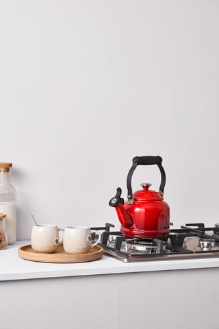 Le Creuset Demi Tea Kettle Cerise enamel lid and knob provide durable, stylish details.