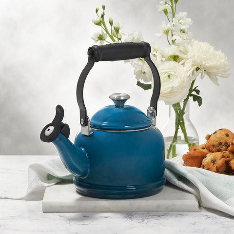 Le Creuset Demi Tea Kettle Oyster enamel finish resists stains and flavors.