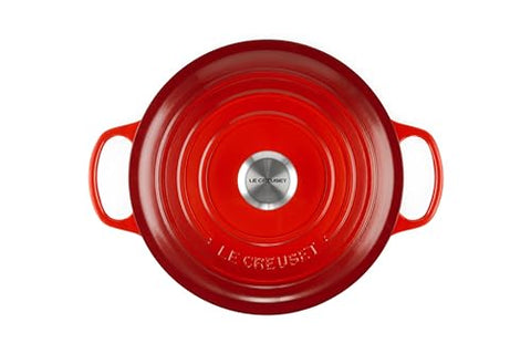 Le Creuset interior enamel in Cerise shows cooking progress clearly.