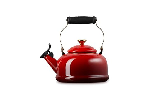 Le Creuset enamel steel kettle whistle closeup, fixed whistle signals a rolling boil for tea prep.